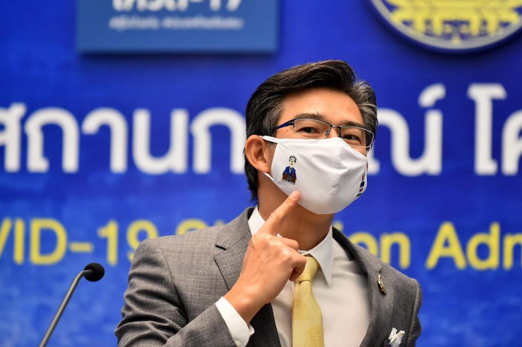 COVID task force spokesman Taweesilp Wisanuyothin wears a mask embroidered with his cartoon likeness. Photo: Prime Minister’s Office
