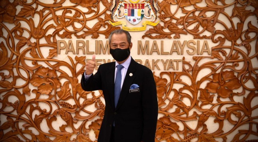 Prime Minister Muhyiddin Yassin gives a thumbs-up at the Parliament building in Kuala Lumpur. Photo: Muhyiddin Yassin