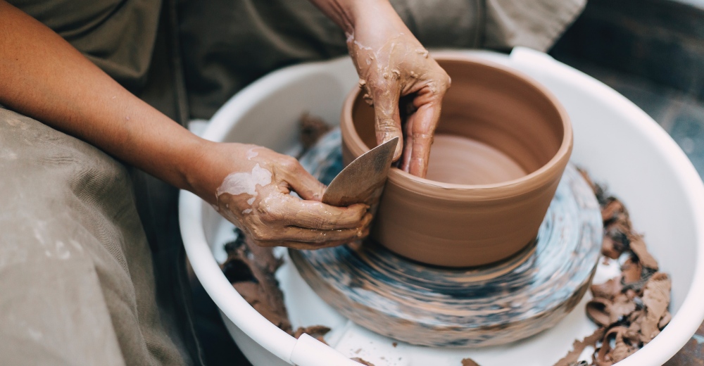 A person doing pottery. Photo: Jade Scarlato