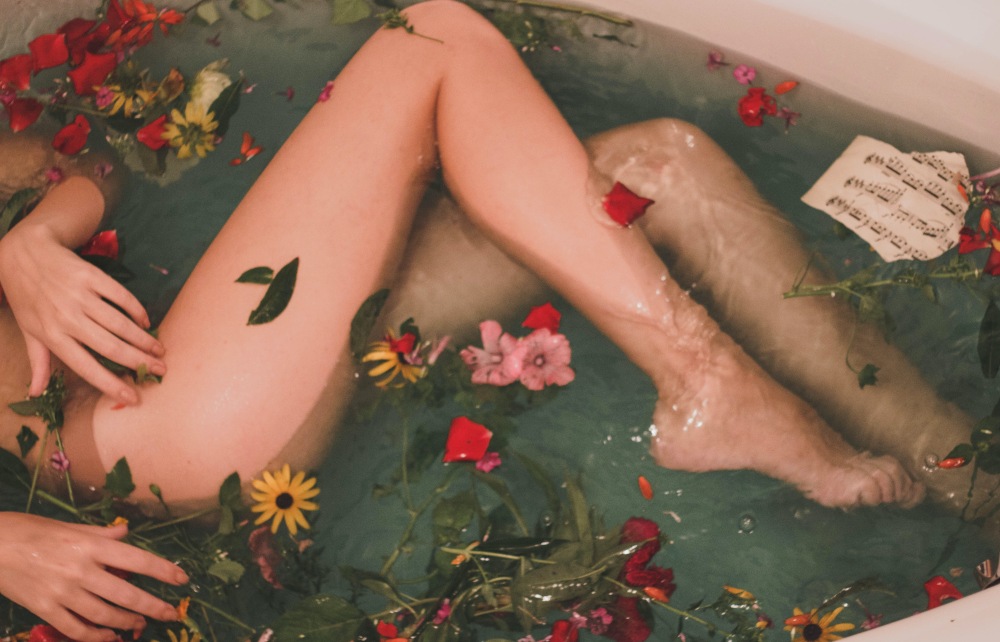 A woman lounging in a flower bath. Photo: Hanna Postova