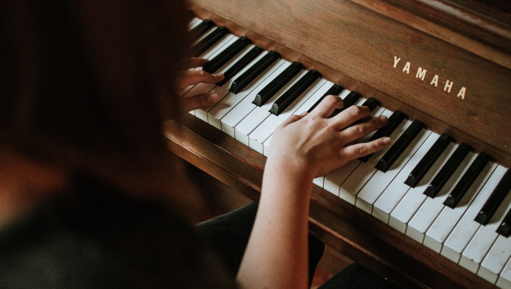A person playing the piano. Photo: Jordan Whitfield