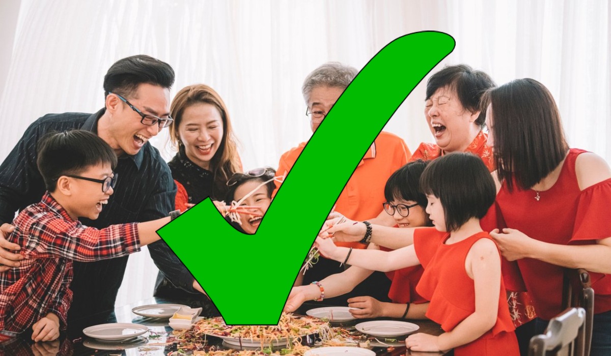The ‘tick’ symbol over a photo of a family tossing salad. Photo: Coconuts
