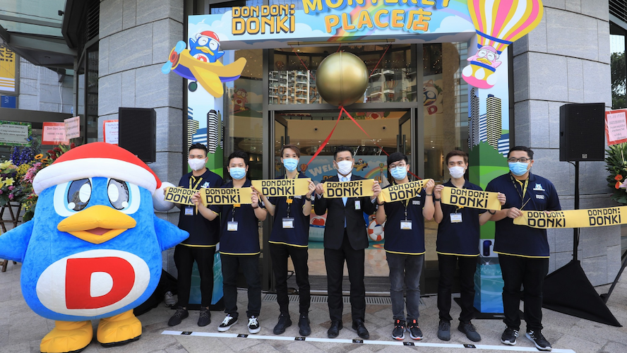 Staff pose outside Don Don Donki’s fifth store at Monterey Place, Tseung Kwan O on opening day. Photo: Facebook/Don Don Donki HK