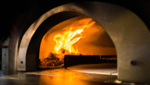 A shot inside the pizza oven that can go up to as high as 800 degrees fahrenheit. Photo: Coconuts