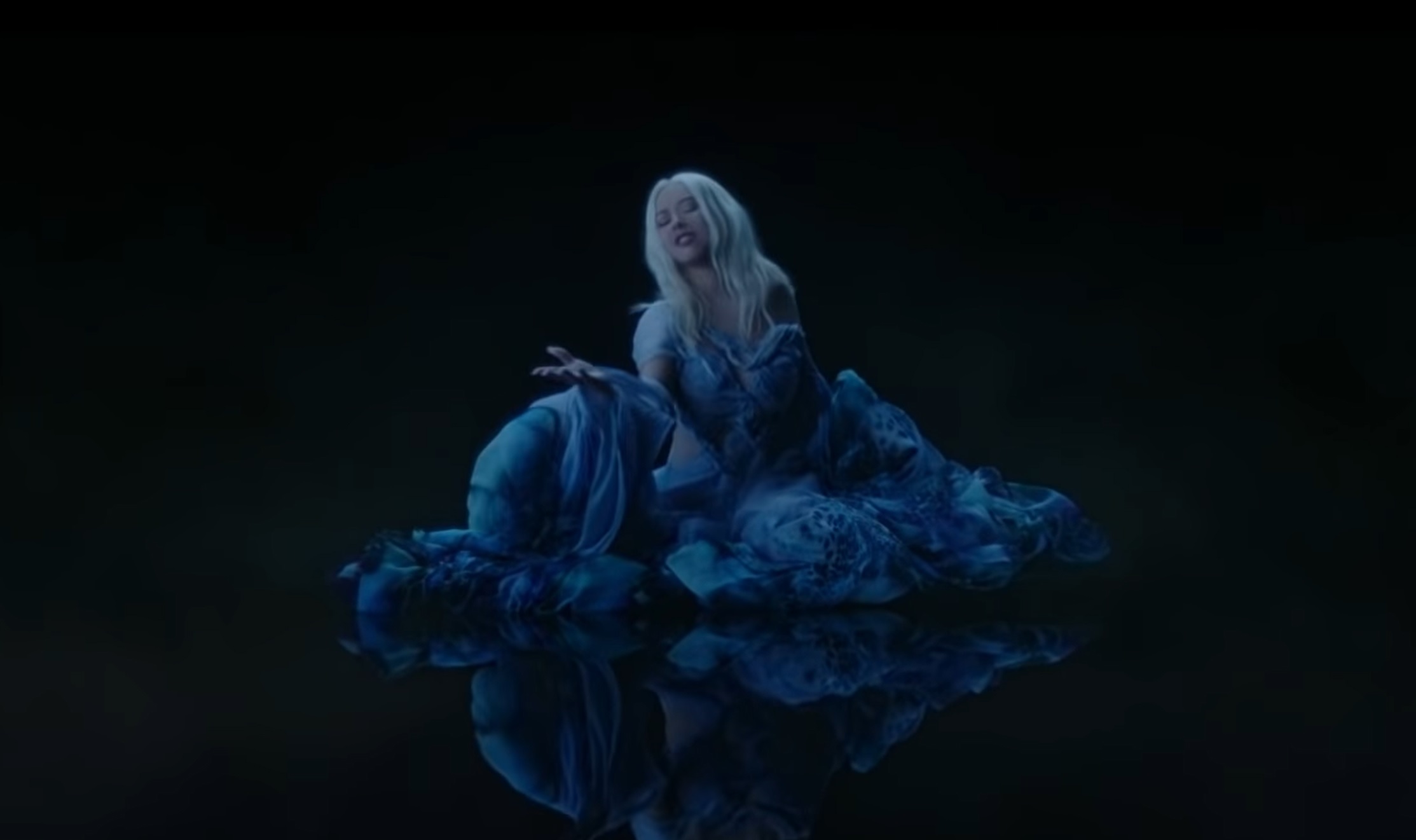 Christina Aguilera wears a blue dress inspired by the ocean from Iris Van Herpen’s Sensory Seas collection. Image: DisneyMusicVEVO / YouTube