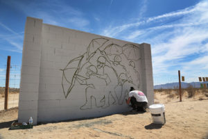 Mitchell is painting in the Liberty Sculpture Park in Mojave Desert. Photo: Thirdblade Photography