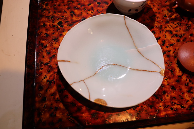 The Japanese Seiji celadon plate he broke in 2016 that began his journey to Kintsugi. Chayanan first tried the method using Thai gold dust. Photo: Coconuts 