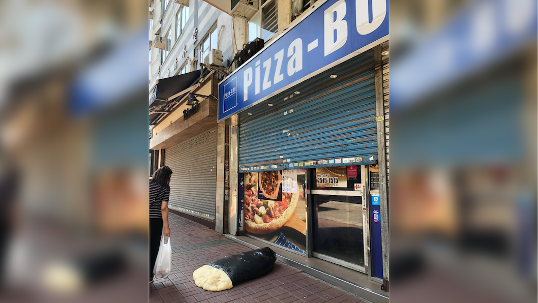 The giant slab of dough, left outside Pizza-Box’s Prince Edward shop, took up half the width of the sidewalk. Photo: Facebook/Ting Ting Wong