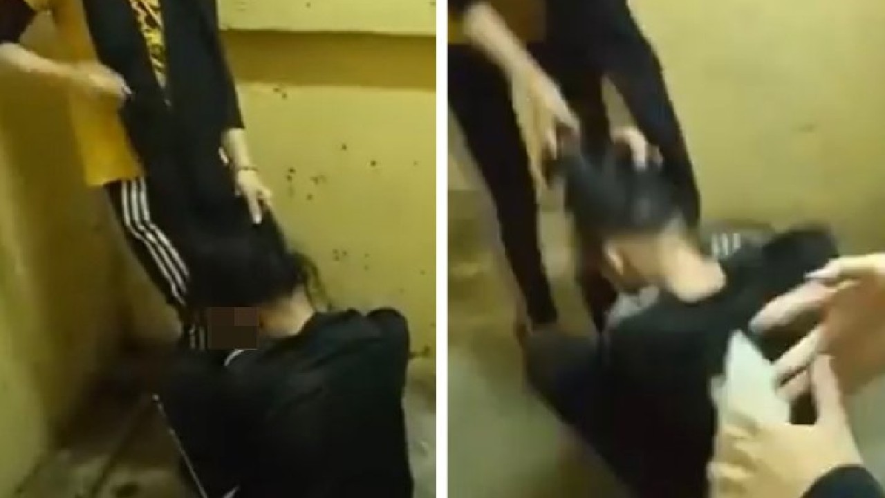Screenshots of a video showing a girl being bullied by several others at a stairwell in Kelana Jaya. 