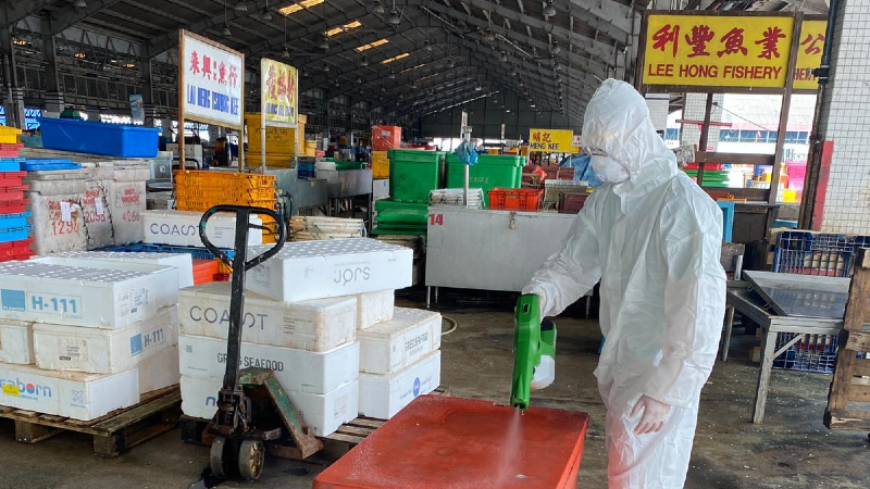 An officer disinfecting the Jurong Fishery Port. Photo: Grace Fu/Facebook
