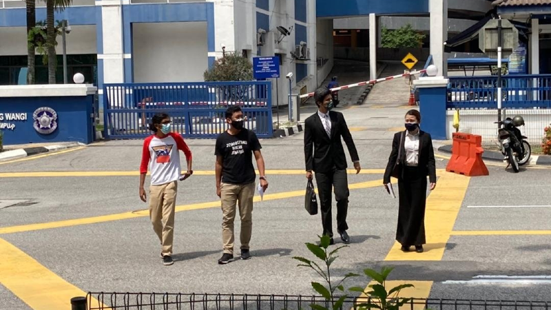 The members of the organization, Mohammad Alshatri (left), leaving the Dang Wangi police station on Sunday after being summoned over the anti-government demonstration at Merdeka Square on Saturday. Photo: Amirx abd hadi/Twitter