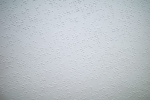 The braille dots on paper. Photo: Coconuts