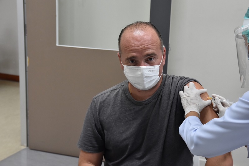 Michael Messner receives a Sinopharm COVID vaccine. 