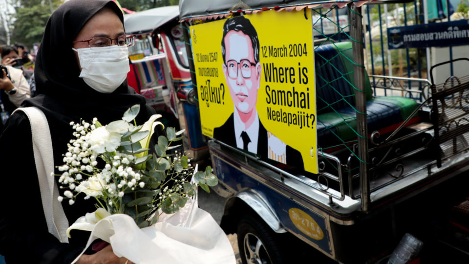 Angkhana Neelapaijit holds an image of her missing husband Somchai Neelapaijit on March 12, 2021, in front of the Department of Special Investigation. Photo: Amnesty Thailand
