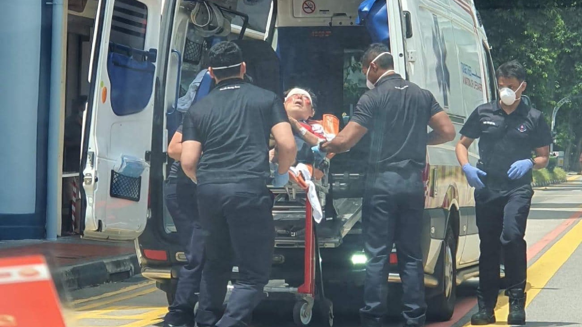 Man being wheeled into an ambulance after bus incident on North Bridge Road. Photo: Siah Hwan Ling. 