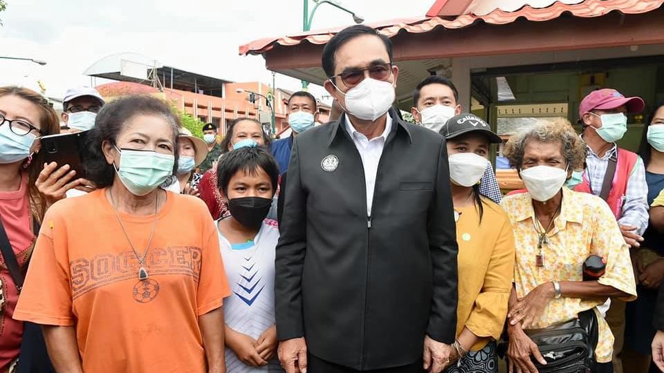 A crowd fantasizes about all their unthrown eggs as they pose today with Prime Minister Prayuth Chan-ocha in Nakhon Si Thammarat.
