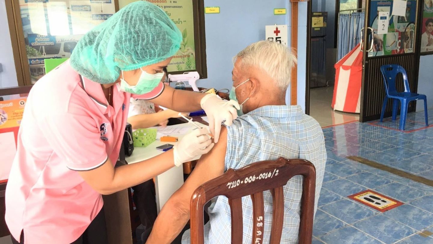 A man sits for an injection in a file photo. Photo: Sa Kaeo Provincial Health Office / Facebook