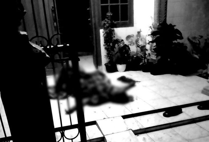 The victim lying on the front porch of her house following the acid attack. Photo: Info Cianjur