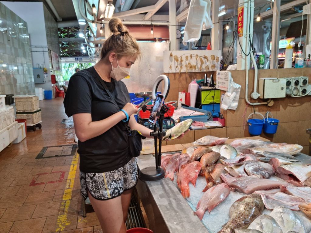 Sio live streams from the wet market. Photo: Xavier Poh