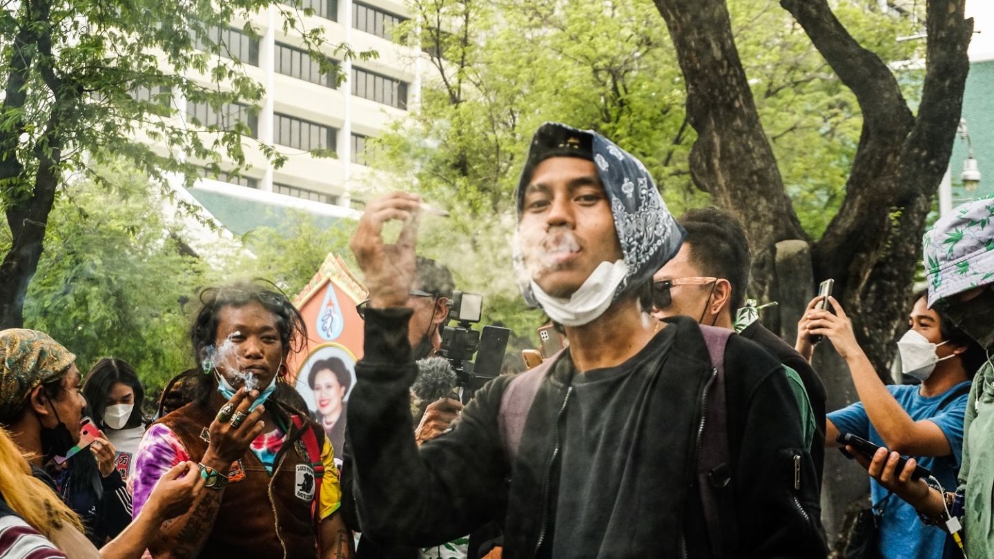 Weed advocates on January 25, 2022, march toward the UN headquarters in Bangkok to light up joints and celebrate the pending decriminalization of cannabis. Photo: Chayanit Itthipongmaetee / Coconuts Bangkok