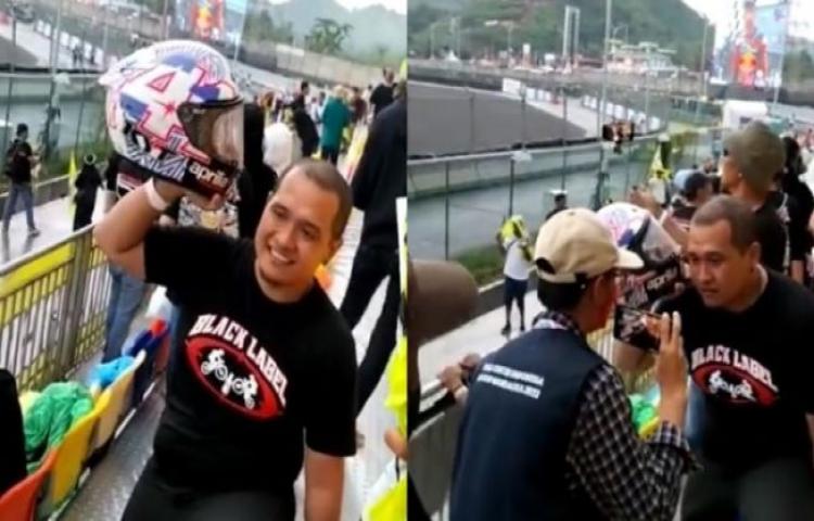 A lucky Indonesian fan was all smiles as he received a helmet rom Spanish MotoGP racer Aleix Espargaró at the conclusion of the 2022 Indonesian MotoGP Race at the Mandalika Circuit in Lombok on March 20, 2022. Photo: Screengrab. 