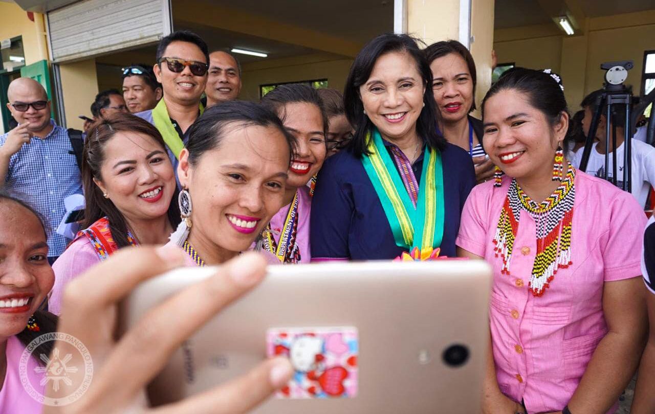 Vice President Leni Robredo poses with teachers during a turnover of a high school dormitory for boys in Sumilao under her office’s Angat Buhay program. Image: VP Leni Robredo