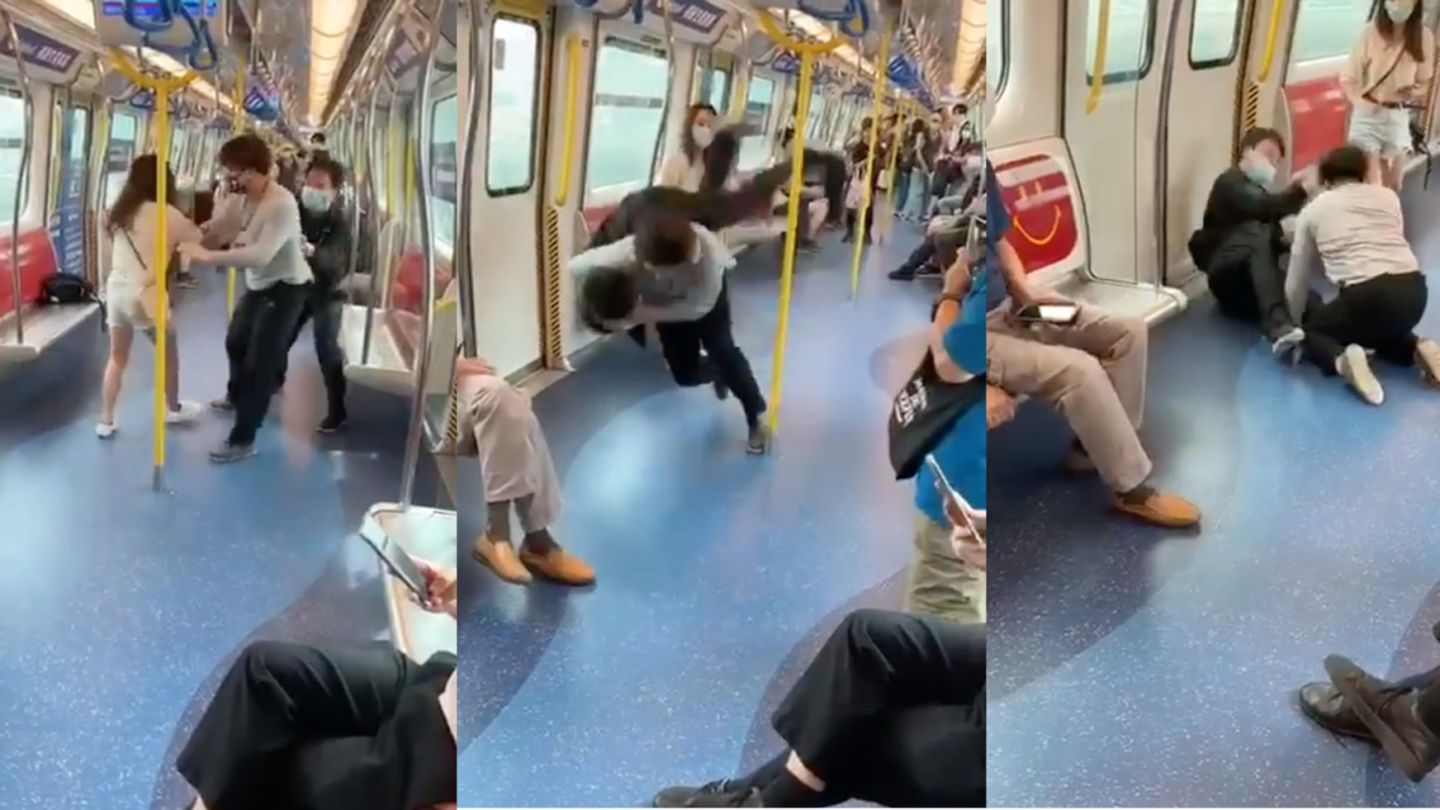 Screengrab of Facebook video by Today Review67 showing two men fighting on an MTR carriage.