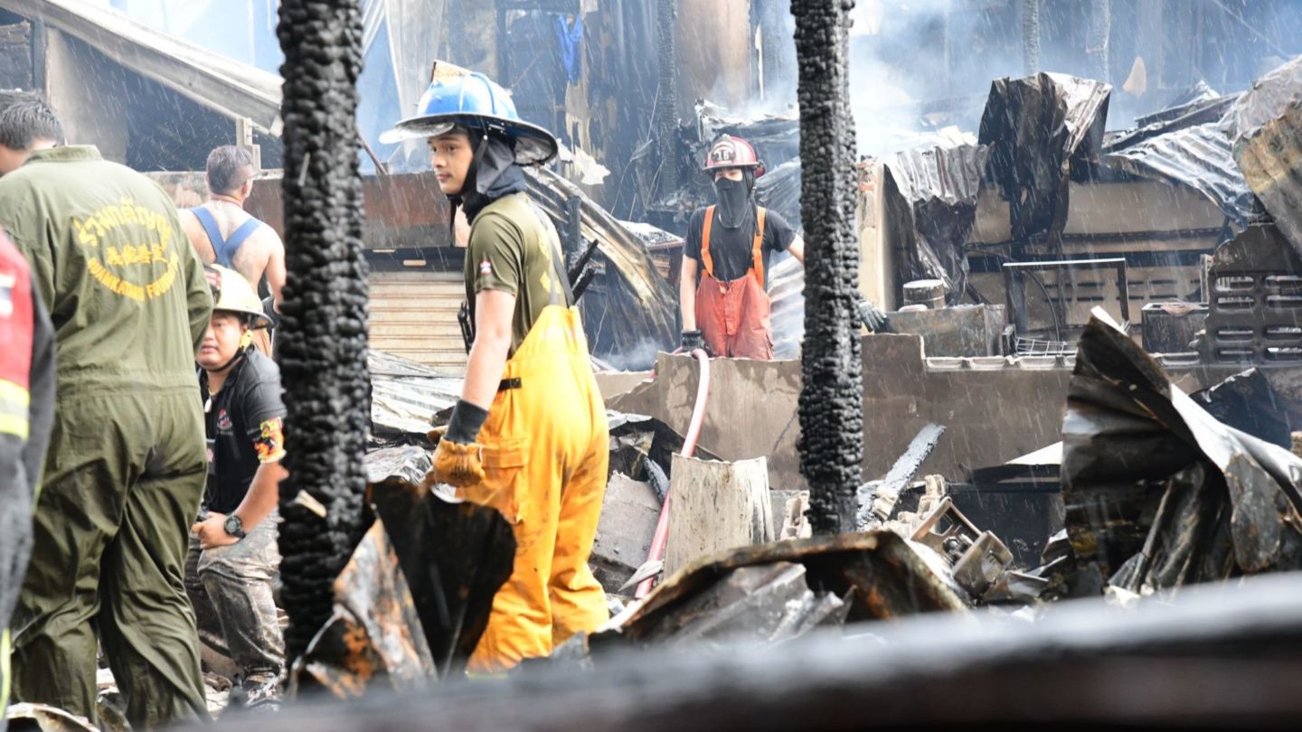 Firefighters survey the Bon Kai community Thursday in Bangkok where a fire destroyed dozens of homes. Photo: The Bangkok Metropolitan Administration
