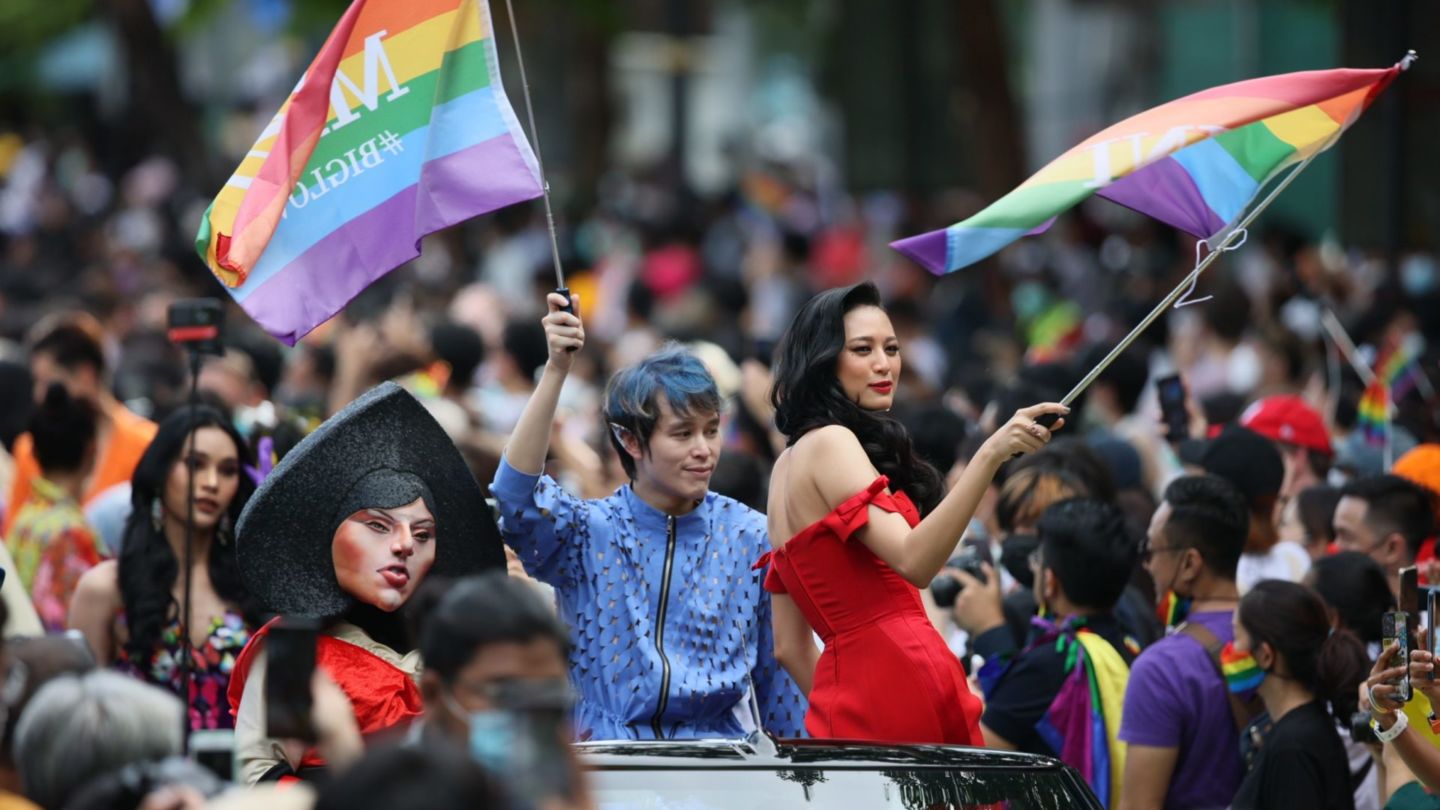 LGBTQ+ rights supporters wave rainbow flags during a June. 5 pride parade held in Bangkok’s Silom area. Photo: Gov. Chadchart Sittipunt
