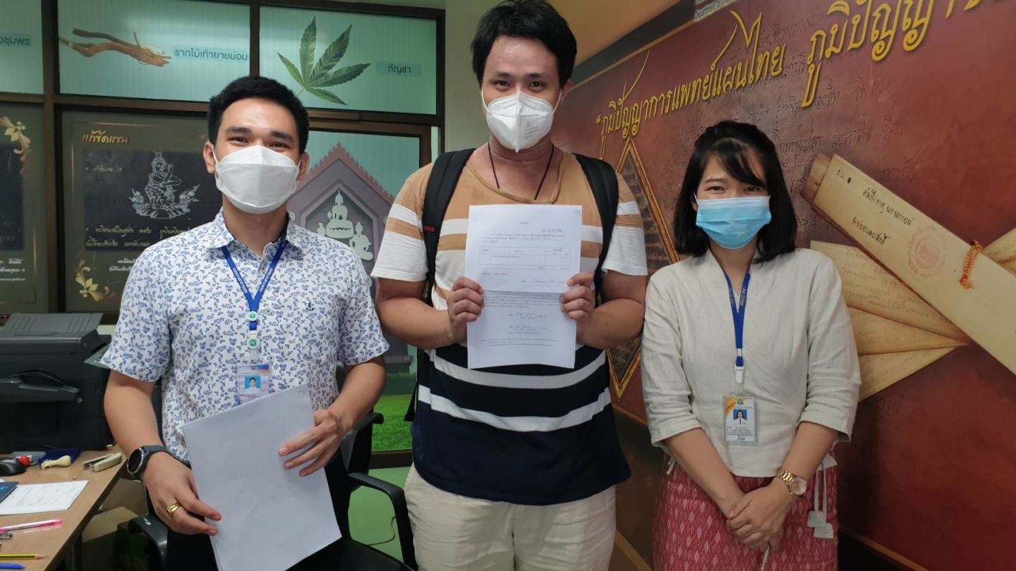 Your humble narrator celebrates the successful application for a retail cannabis license alongside the fine people of the Department of Thai Traditional and Complementary Medicine at the Public Health Ministry in Nonthaburi province. Photo: Coconuts
