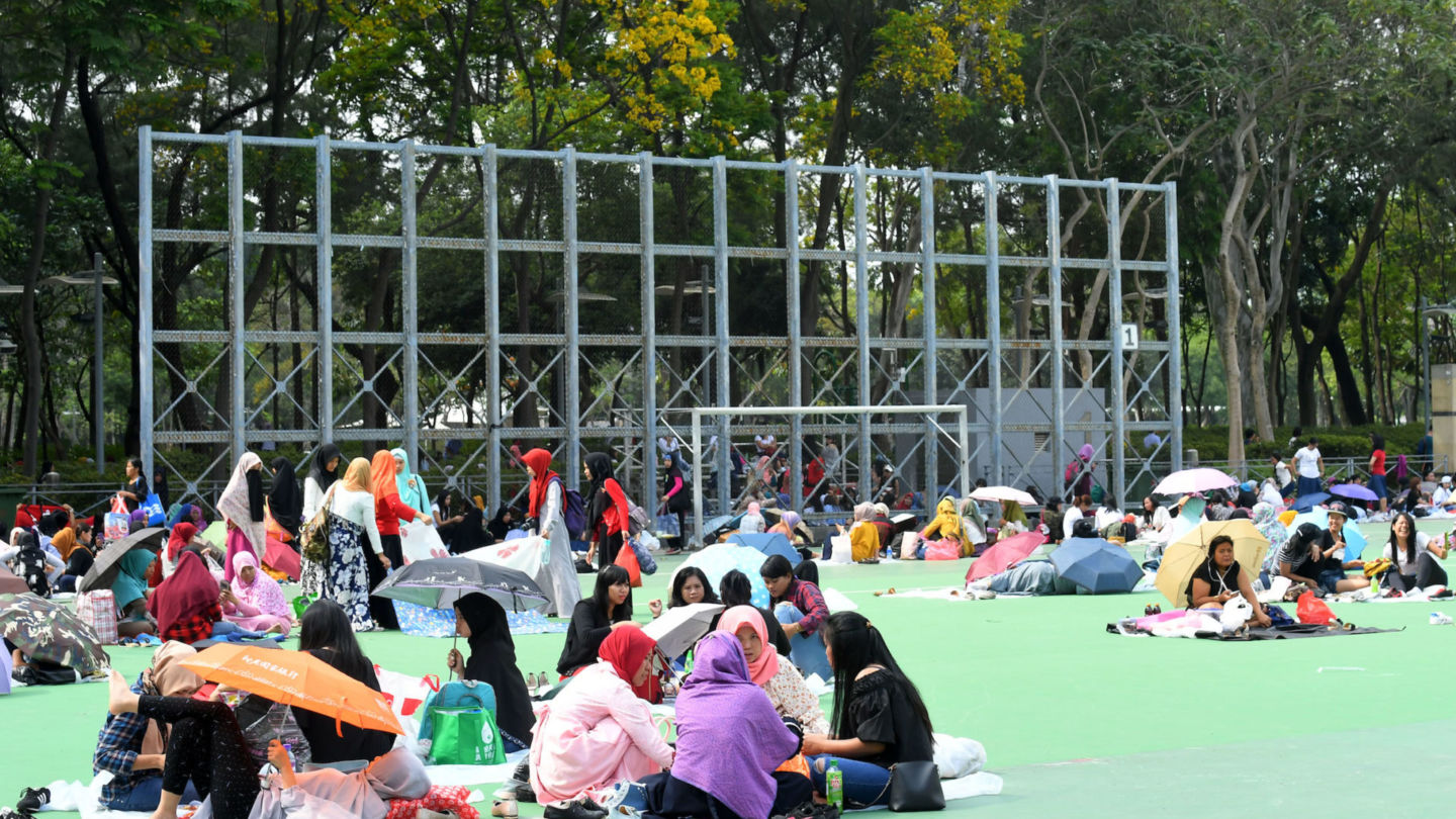 Domestic workers gather on their rest day at Victoria Park in Causeway Bay. Photo: Hong Kong’s Information Services Department