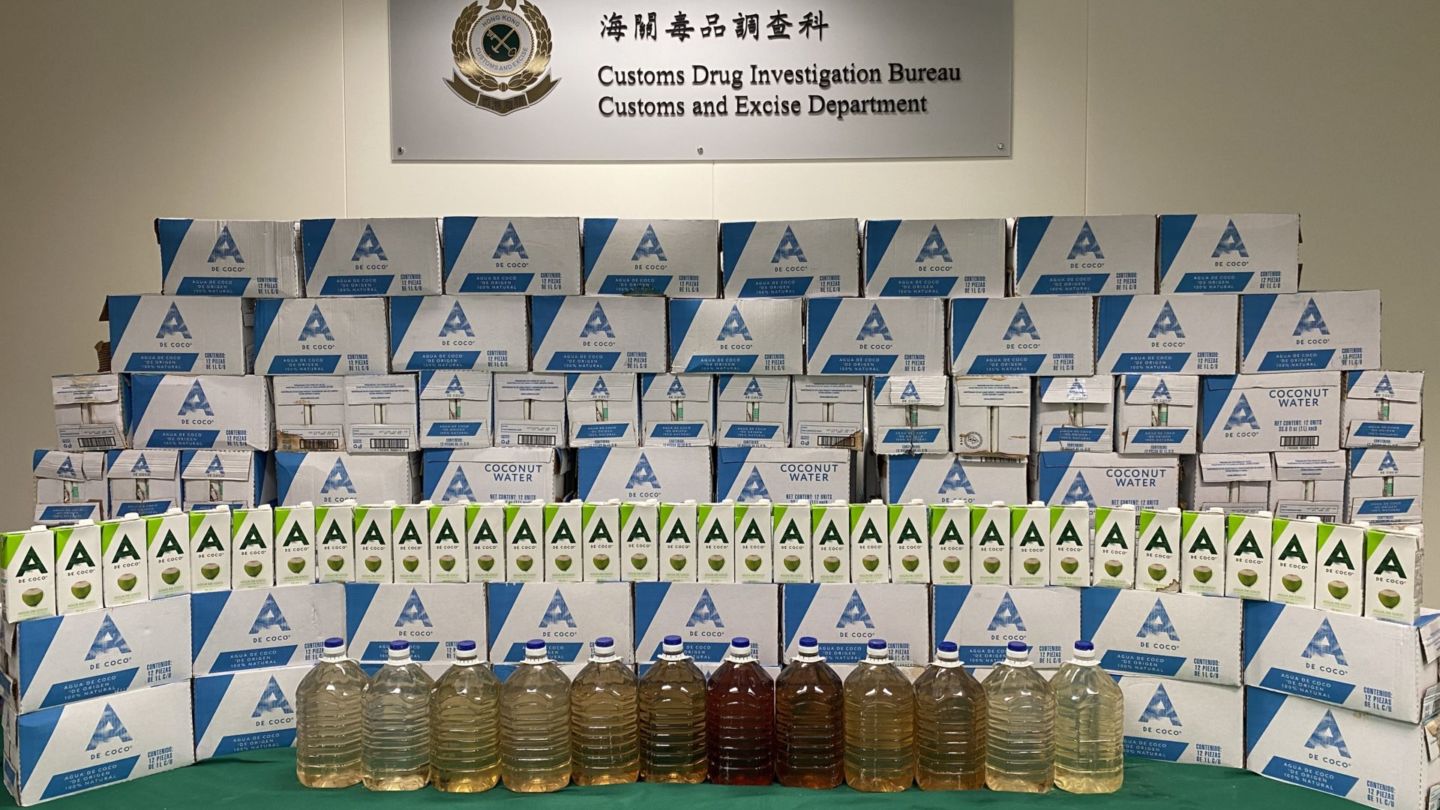 Bottles of liquid meth and the coconut water boxes they were concealed in. Photo: Hong Kong Customs and Excise