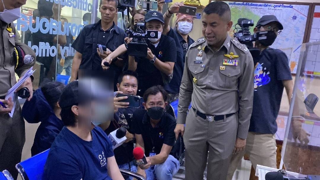 Surachet “Big Joke” Hakpan speaks Sunday night to the man police said murdered and dismembered a woman with whom he was romantically involved. Photo: Samrong Nuea Police Station