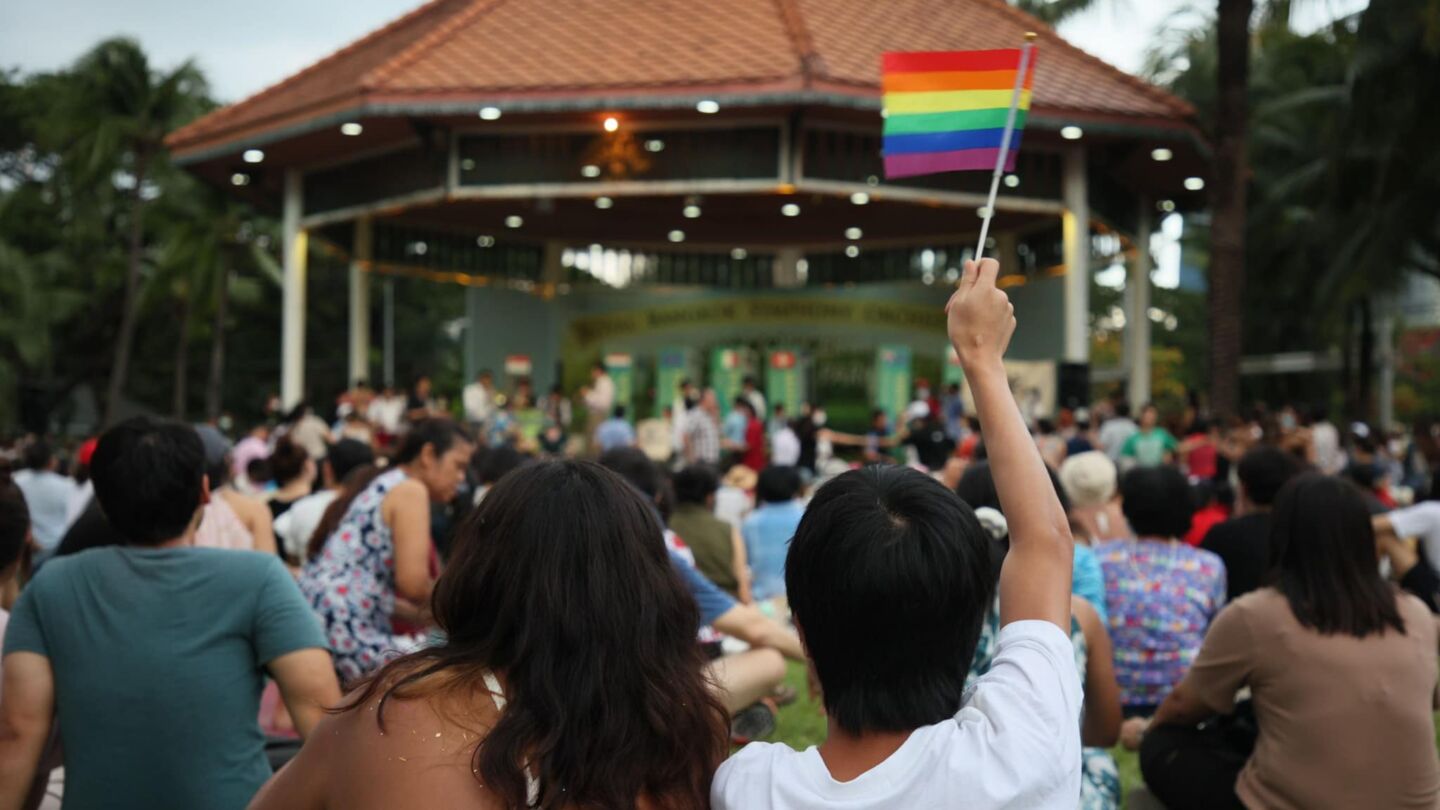 A participant waves a rainbow flag at a swing dance event in June, 2020, at Suan Rot Fai in Bangkok. Photo: Gov. Chadchart Sittipunt