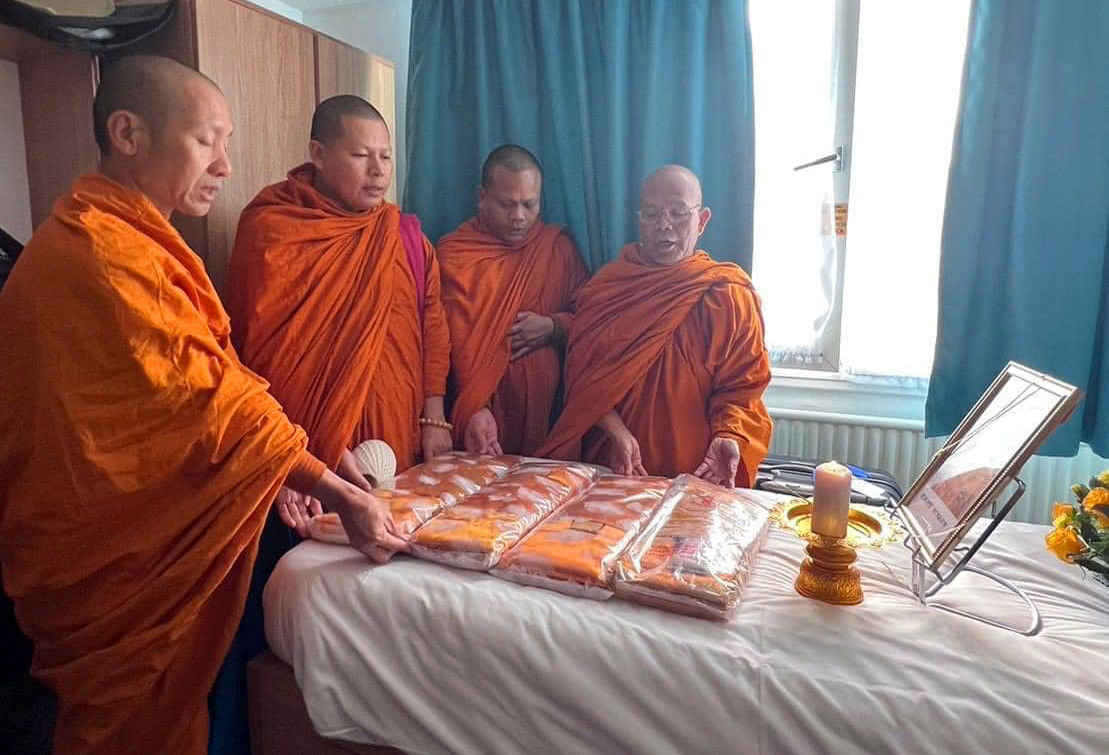 Monks pray in the room where 17-year-old Duangphet “Dom” Phromthep was found unresponsive earlier this month. The boy died on Feb. 14 at a hospital in Leicester, England, where he had gone to study four years after he was rescued from a cave in northern Thailand. Photo: Zico Foundation