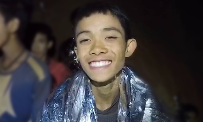 Duangphet “Dom” Phromthep smiles into the camera from inside Tham Luang in 2018 in footage taken by divers.