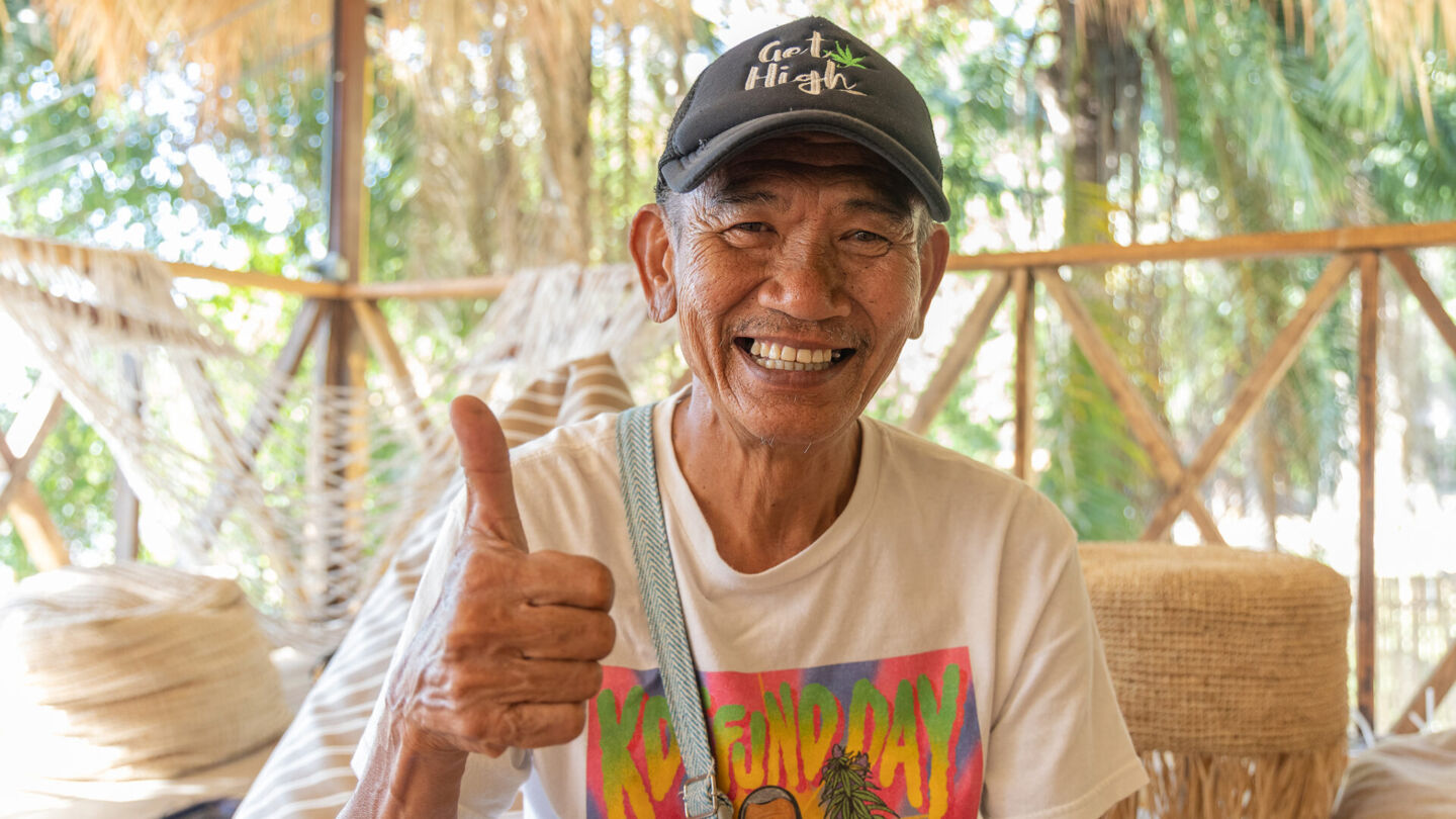Aram “Uncle Dam” Limsakul smiles for a February 2023 photo. The long-time weed veteran is nicknamed the “father of medical weed” on Koh Tao and is known for his KD Koh Tao, Thai landrace strain he grows on the island. Photo: Phuket Cannabis Association