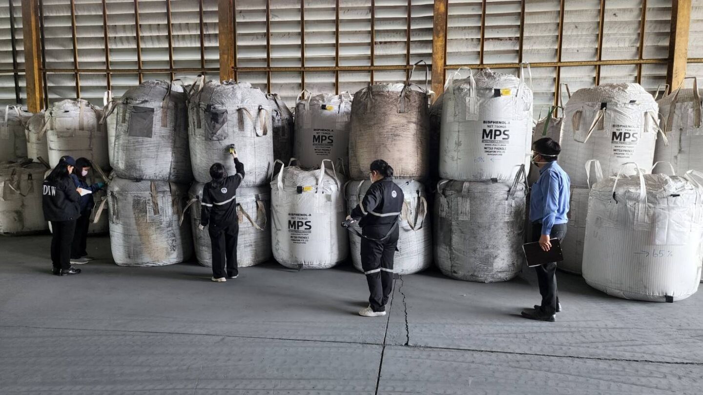 Large bags containing steel smelting byproduct are examined due to fears they could contain radioactive isotope Cesium-137. Photo: Rayong Provincial Office